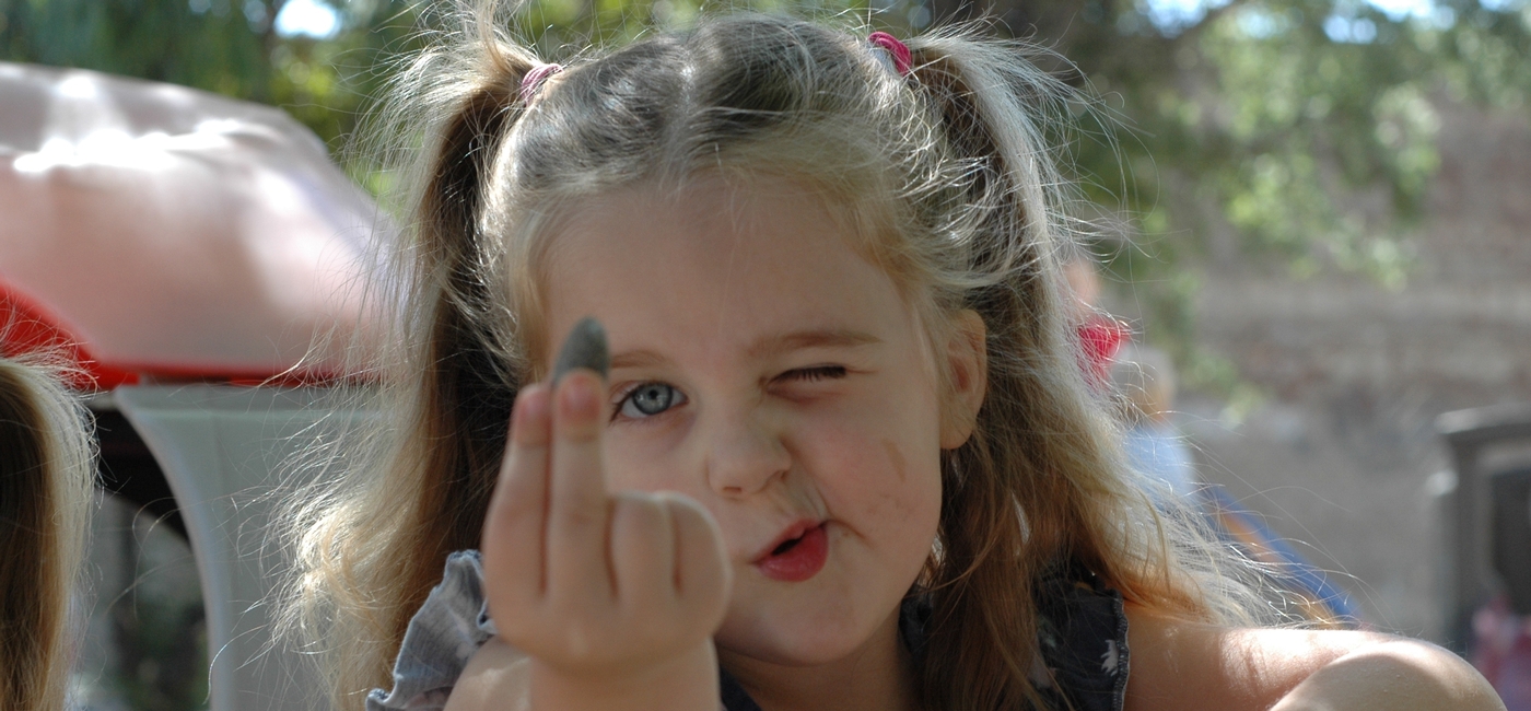 child holding a rock